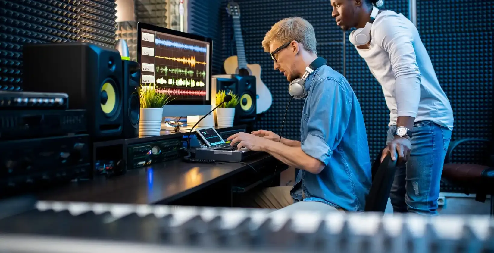 Music producer finalizing song with singer